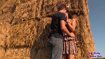 Her short skirt and her giant tits turn the guy on as he fucks her on the hay bales